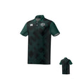 The WOODLANDS YOUTH RUGBY CANTERBURY ECO-SUBLIMATE SS POLO by Teamatical features dark green and black colors, a large X pattern, sports logo on the left chest, and a white logo on the right; front and back views shown.