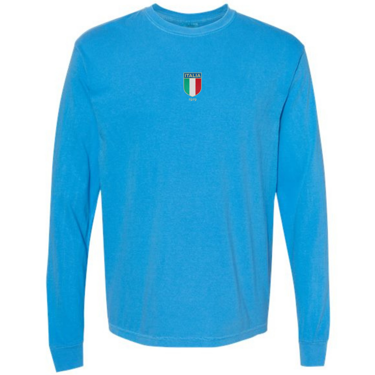 The Italy Vintage Long Sleeve Comfort Tee by EMB S&S Activewear features a light blue color, long sleeves, and a small Italia crest with Italian flag colors and text on the chest for a classic vintage vibe.