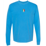 The Italy Vintage Long Sleeve Comfort Tee by EMB S&S Activewear features a light blue color, long sleeves, and a small Italia crest with Italian flag colors and text on the chest for a classic vintage vibe.