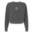 The EMB S&S Activewear Women's Mudsock Rugby Club Mid-Length Crewneck Sweatshirt is garment-dyed charcoal gray with long sleeves and features a small round logo on the chest.