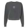 The EMB S&S Activewear Women's Mudsock Rugby Club Mid-Length Crewneck Sweatshirt is garment-dyed charcoal gray with long sleeves and features a small round logo on the chest.