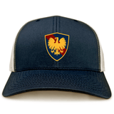 Cincinnati Classical Academy navy blue and white retro trucker cap with a shield emblem featuring a golden eagle on a red background by EMB Alpha Broder.