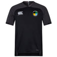 The SOCAL SANZAS RFC Vapodri Evader Jersey by EMB Canterbury is a black, short-sleeve rugby jersey featuring the Canterbury logo on the right chest, a circular multicolor crest on the left, and moisture-wicking Vapodri technology for comfort.