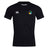 The EMB Canterbury SOCAL SANZAS RFC Club Dry Tee is a black short-sleeve top with a white Canterbury logo on the right chest, a multicolored circular emblem on the left, and Vapodri Technology for superior comfort during workouts.