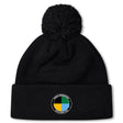 The SOCAL SANZAS RFC Pom Pom Beanie by EMB Canterbury is a black rugby hat with a pom-pom and a circular patch on the brim, featuring colored segments and "Las Vegas Invitational Social Rugby Club" text.
