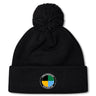 The SOCAL SANZAS RFC Pom Pom Beanie by EMB Canterbury is a black rugby hat with a pom-pom and a circular patch on the brim, featuring colored segments and "Las Vegas Invitational Social Rugby Club" text.