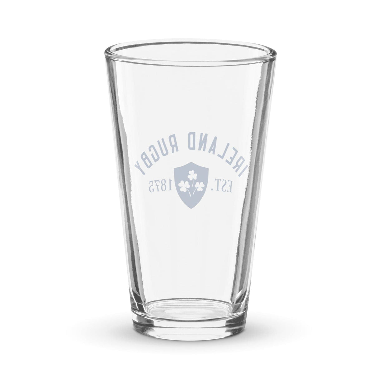 A clear navy shaker pint glass by PF LIC, featuring a design that reads "Ireland Rugby Est. 1875" along with a shamrock emblem, this handmade piece of glassware celebrates the rich heritage of Ireland rugby.