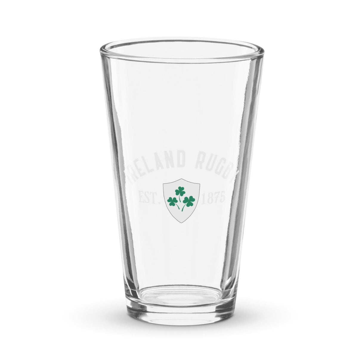 A clear Ireland Est 1875 Shaker Pint Glass from PF LIC showcases the Ireland Rugby logo, adorned with green shamrocks and the text "Ireland Rugby Est. 1875" on the front.