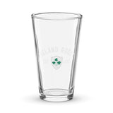 A clear Ireland Est 1875 Shaker Pint Glass from PF LIC showcases the Ireland Rugby logo, adorned with green shamrocks and the text "Ireland Rugby Est. 1875" on the front.