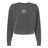 Introducing the Society of Iowa Rugby Referees Women’s Garment-Dyed Mid-Length Crewneck Sweatshirt by EMB S&S Activewear. Crafted from heavyweight fleece for lasting warmth and comfort, this dark gray crewneck features a long-sleeve design and is garment-dyed for a unique finish. A small circular floral emblem is centered on the chest, adding a subtle accent to this cozy staple.