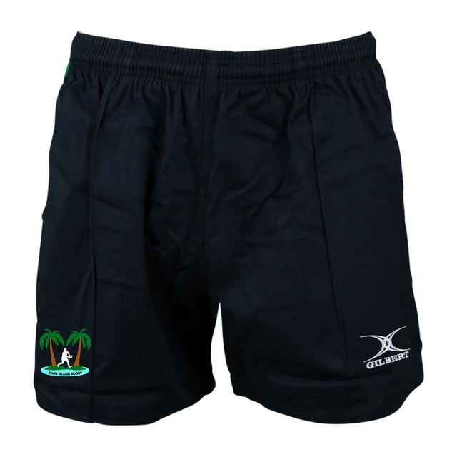 The Twin Island Rugby Kiwi Pro Rugby Shorts by EMB Gilbert are black athletic shorts featuring an elastic waistband, with a palm tree and wave logo adorning one leg. The "GILBERT" logo is prominently displayed on the other, making them perfect for fans of Gilbert rugby shorts.
