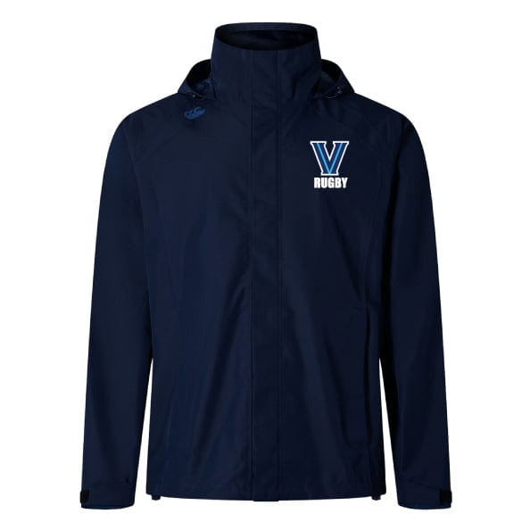The Villanova Rugby Elite Storm Jacket by EMB Canterbury is a navy blue jacket featuring a "V Rugby" logo on the chest, high collar, and hood. It's designed with Vaposhield performance for waterproof protection against the elements.