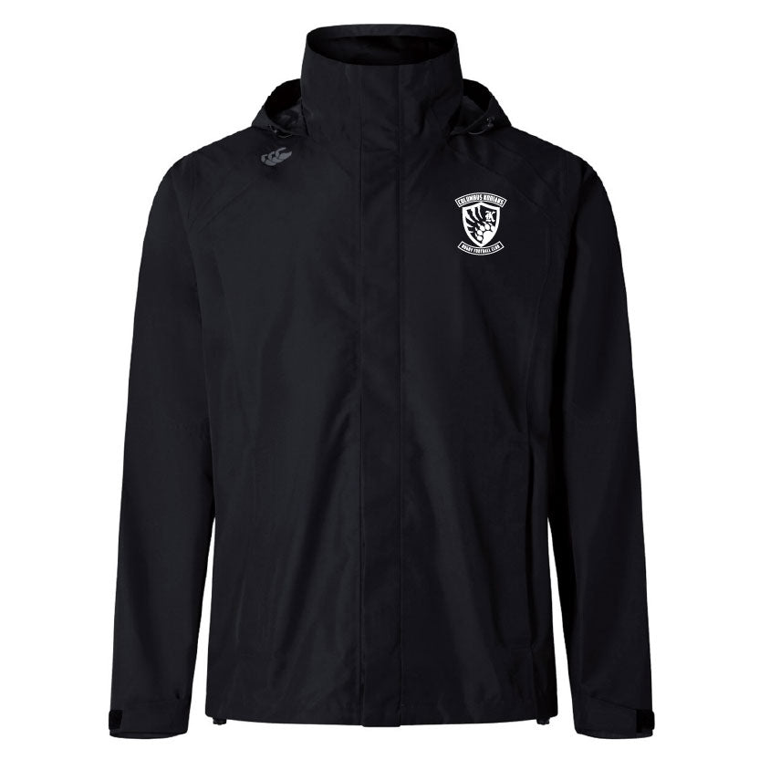 The Columbus Kodiaks Elite Storm Jacket by Canterbury is a black hooded waterproof jacket with a white crest on the left chest, a white logo on the right shoulder, and Vaposhield tech for breathability. Brand: EMB Canterbury.