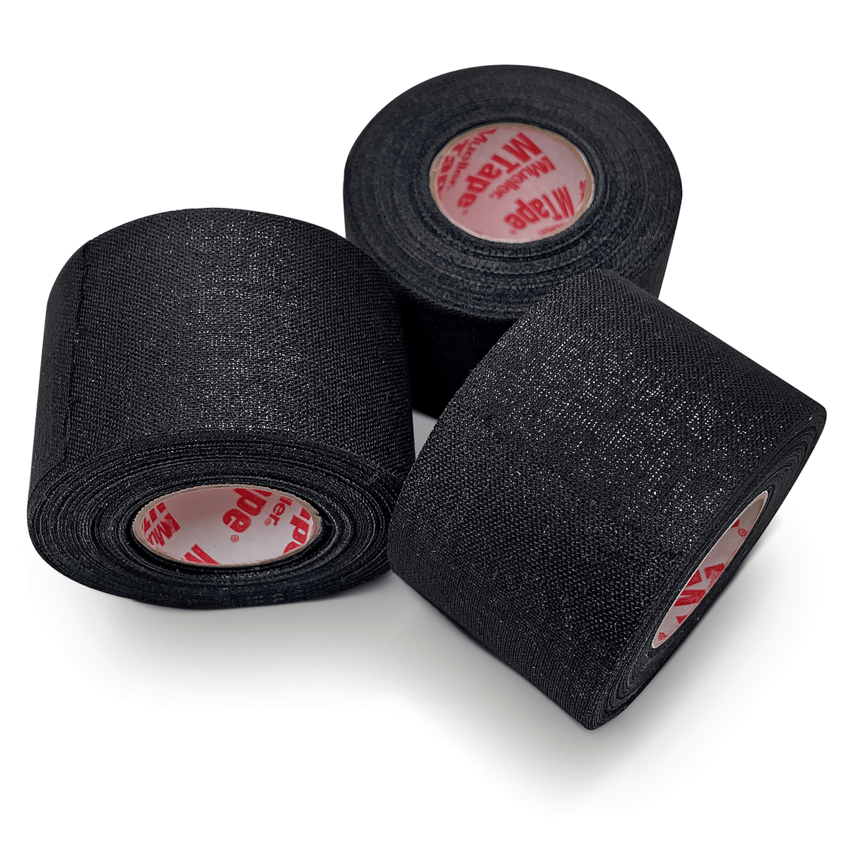 Three rolls from the Mueller Mtape Case-32 Tape Rolls, by Mueller, are arranged with one roll standing upright and two lying on their sides, perfect for any sports medicine needs.