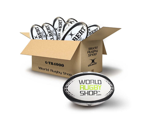 A cardboard box labeled "World Rugby Shop" holds several Bundle Gilbert WRS G-TR4000 Rugby Training Balls, with one prominently displaying the "World Rugby Shop" logo in front.