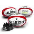 Three Gilbert WRS G-TR4000 Red Rugby Training Balls Size 5 with Kicking Tee sitting next to each other.