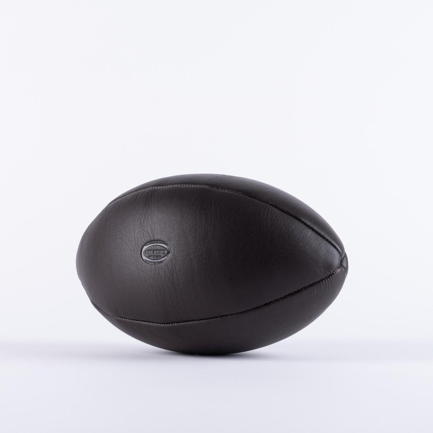 A Wales Rugby Vintage Leather Ball by Gilbert on a white background.