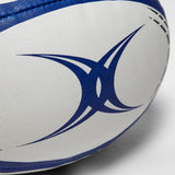 A white and blue Gilbert G-TR4000 Training Ball on a white surface.