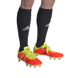 A soccer player wearing Adidas Kakari Z.0 SG - Solar Red shoes from adidas.