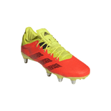 An adidas Kakari Z.0 SG - Solar Red soccer shoe on a green background.