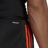 A man's All Blacks Gym Shorts by adidas with orange stripes.