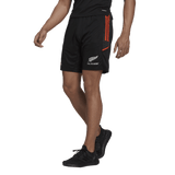 A New Zealand rugby player in All Blacks Gym Shorts by adidas in black and orange.