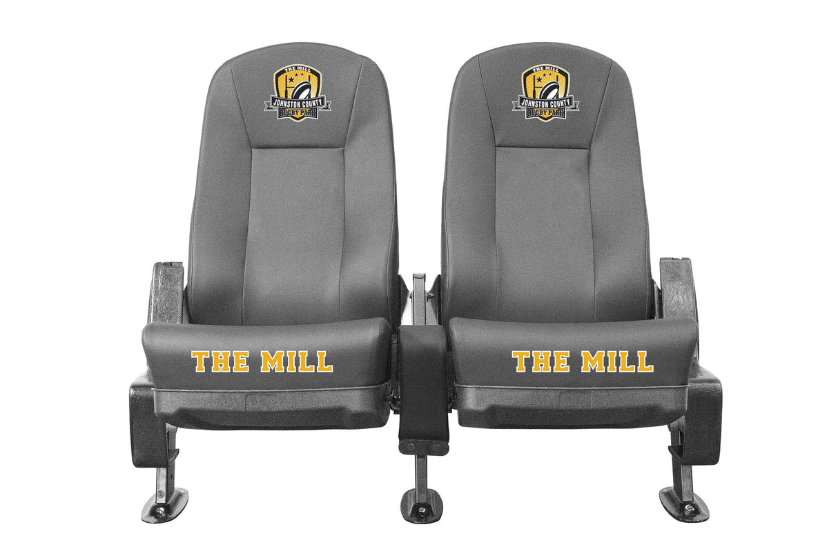 Two Kwik Goal Two-Row Portable Only Rugby Shelters with armrests and wheels, labeled "the mill" in yellow text, featuring a logo on the headrest, designed for use as luxury seating.