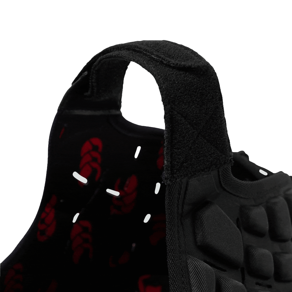 Black velcro chin strap on Raze rugby scrum cap with red CCC lining on inside.