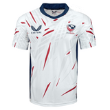 White short sleeve slight v-neck shirt with navy neck and side trim. Red, white and gray pattern with Castore symbol on right chest and USA Rugby on the left chest. 