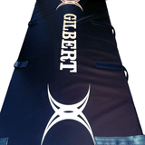a close up of a Gilbert Economy Wrap Black Rugby Post Pad with a spider on it.