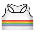 White sports bra with black piping and rainbow colored stripes across the middle. 
