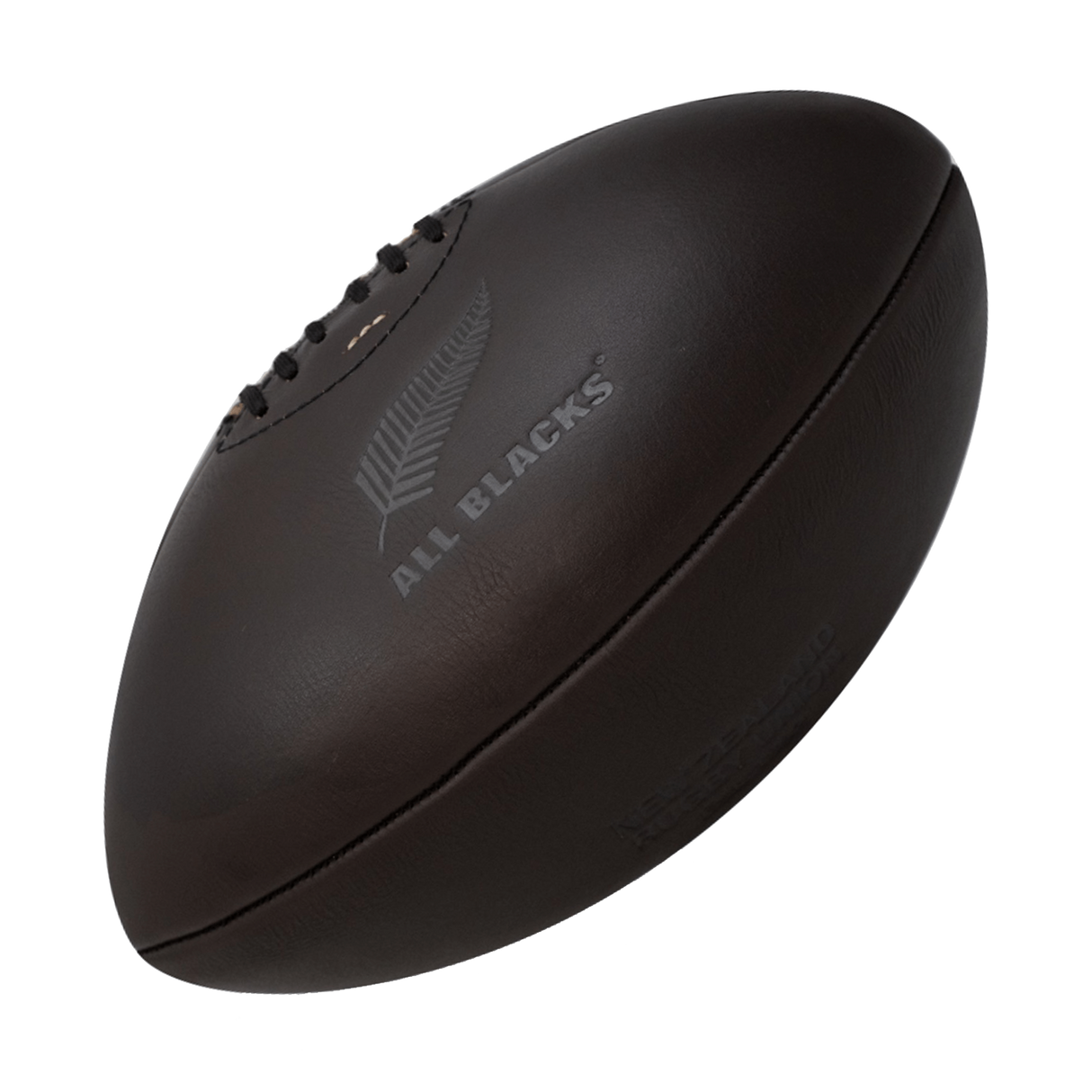 A Gilbert All Blacks Vintage Leather Ball on a black background.