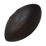 A Gilbert All Blacks Vintage Leather Ball on a black background.