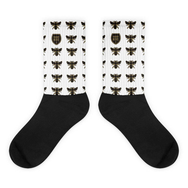A pair of Rugby Hive Crew Socks with bees on them.