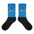 Crew socks with black feet and a blue on blue geometric design up the leg with a Manu Samoa logo.