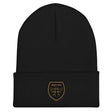 A Rugby Hive Cuffed Beanie with a gold emblem on it.