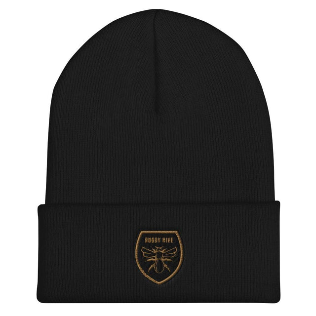 A Rugby Hive Cuffed Beanie with a gold emblem on it.