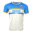 Round neck, short sleeve jersey. Upper chest light blue with Uruguay on upper left chest. Yellow horizontal stipe across upper center of chest and sleeves trimmed in yellow. Light blue horizontal stripe with Uruguay centered and Rugby below. White lower torso.