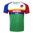 Round neck, short sleeve Namibia jersey. White upper chest with flag detail on upper left side. Right shoulder and sleeve trimmed in red while left shoulder and sleeve in all red. Horizontal yellow, red and blue stipes in the center with white Namibia in the red stripe and Rugby in the blue stripe. Green lower torso.