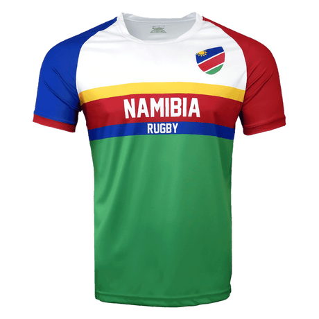 Round neck, short sleeve Namibia jersey. White upper chest with flag detail on upper left side. Right shoulder and sleeve trimmed in red while left shoulder and sleeve in all red. Horizontal yellow, red and blue stipes in the center with white Namibia in the red stripe and Rugby in the blue stripe. Green lower torso.