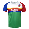 Round neck, short sleeve Namibia jersey. White upper chest with flag detail on upper left side. Right shoulder and sleeve trimmed in red while left shoulder and sleeve in all red. Horizontal yellow, red and blue stipes in the center with white Namibia in the red stripe and Rugby in the blue stripe. Green lower torso.