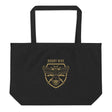A Rugby Hive Eco Tote Bag with a gold bee on it.