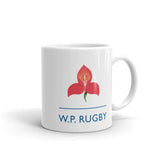 a W.P. Rugby Mug with a red flower on it.
