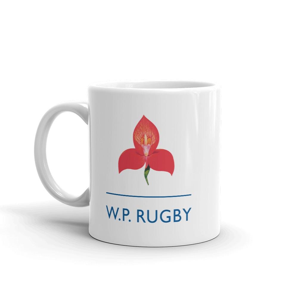 a W.P. Rugby Mug with a red flower on it.