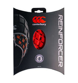 The packaging for the Canterbury Reinforcer Rugby Headgear Scrum Cap features an oval cutout that displays the brand logo and product, with visible Wendition for World Rugby approval. The box is black with red and white accents, aligning with the World Rugby Specification for rugby headgear.