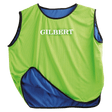 A neon green Gilbert reversible rugby bib with the word GILBERT printed on it.