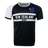 Round neck short sleeve jersey. White right shoulder trimmed in black. Chest and right shoulder in black. Two white center stripes with New Zealand in the center and Rugby below. The New Zealand flag sits on the upper left chest.