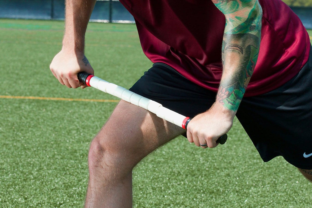 Athlete Demonstrating Use of Recovery Stick on Upper Leg