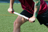 Athlete Demonstrating Use of Recovery Stick on Upper Leg