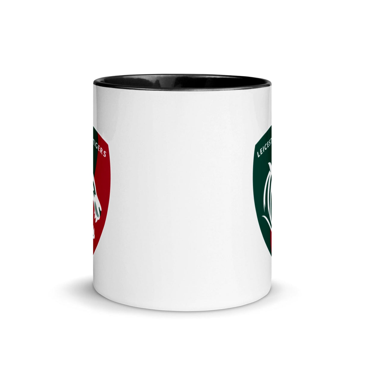 White ceramic mug black interior and a green, red and white Leicester Tigers logo on each side.